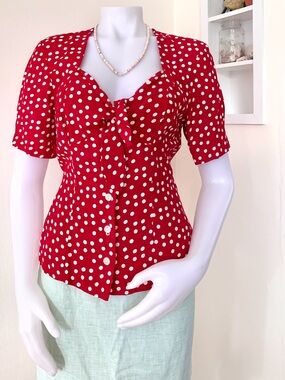 1980s red with white polka dots structured short sleeve tie front top by Leger